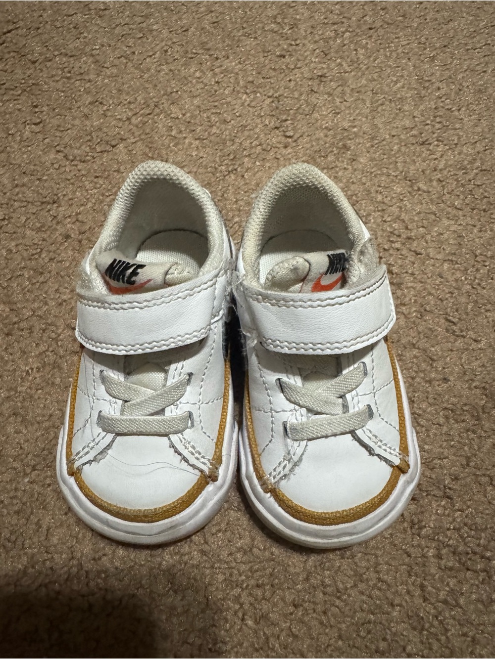 Nike Toddler White Sneakers with Tan Trim and Orange Swoosh